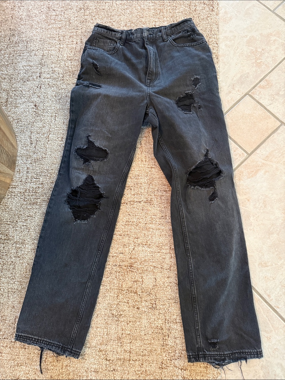 We The Free black denim jeans label visible